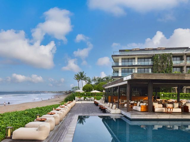 a beach bar with an oceanfront pool at Alila Seminyak 