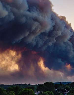 A view from the village of Flayosc (Var) of an impressive plume of smoke rising above Pontevès, where a forest fire has broken out