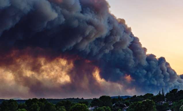 A view from the village of Flayosc (Var) of an impressive plume of smoke rising above Pontevès, where a forest fire has broken out