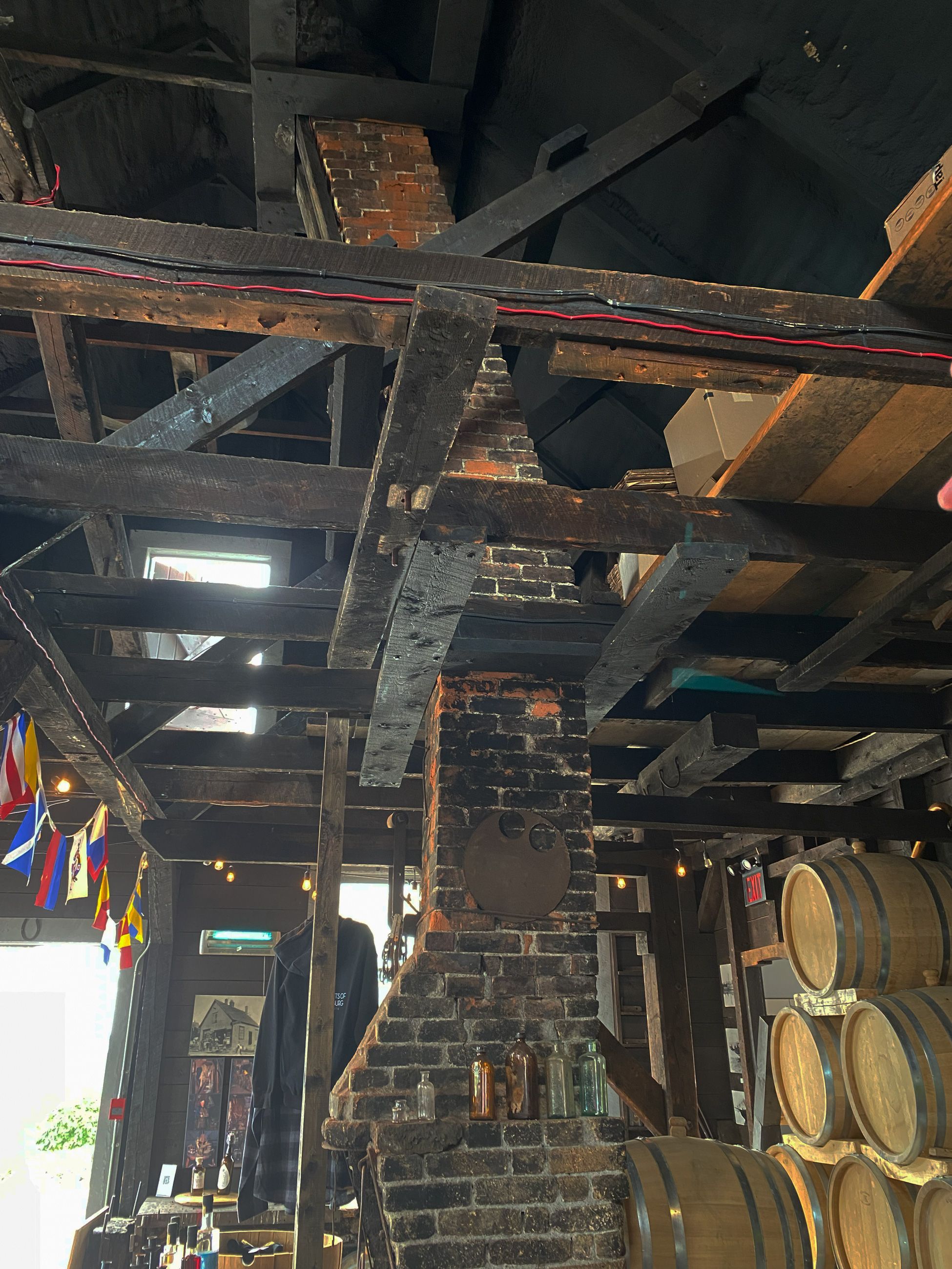 The crooked chimney inside the historic Ironworks Distillery building.
