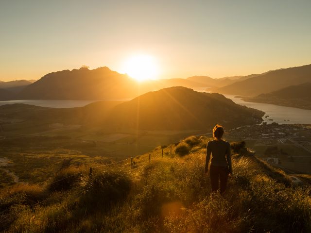 woman hiking around queenstown new zealand
