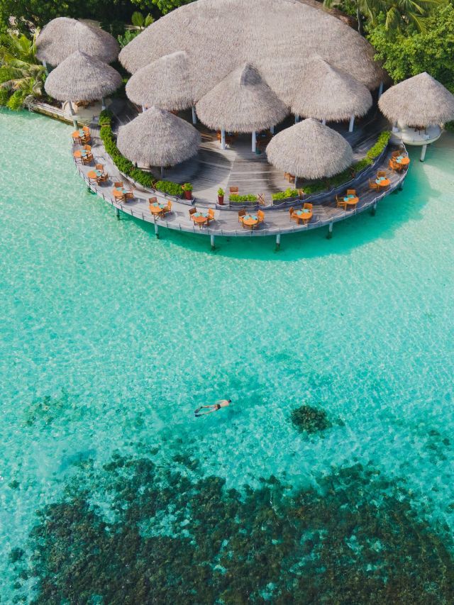 the Cayenne Grill restaurant over the clear turquoise lagoon at Baros Maldives