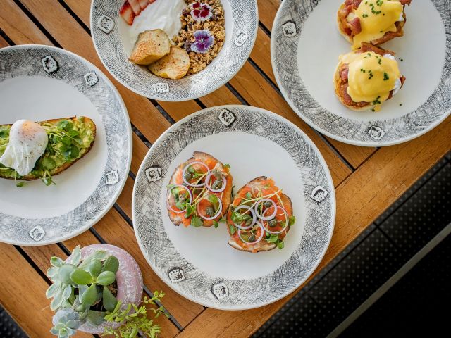 a table full of a food at new zealand restaurant