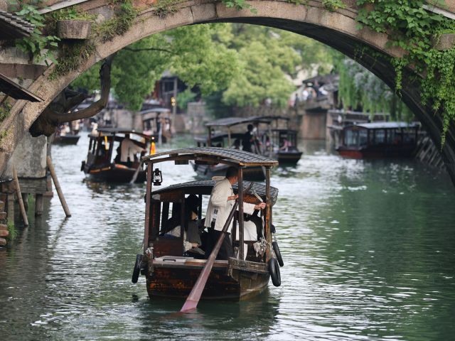 boats gliding past ancient canals in Zhujiajiao
