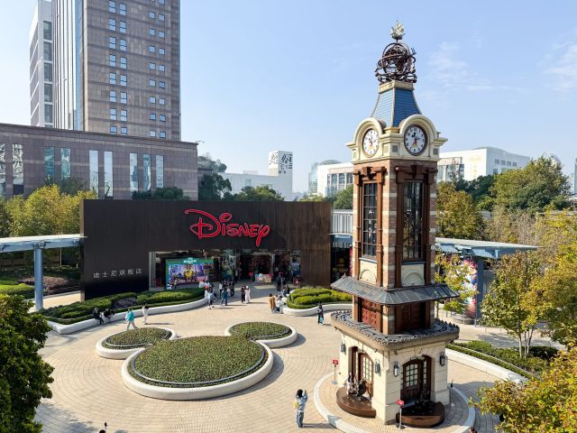 the Disney Town Clock Tower and Mickey Mouse Topiary Garden at Shanghai Disneyland
