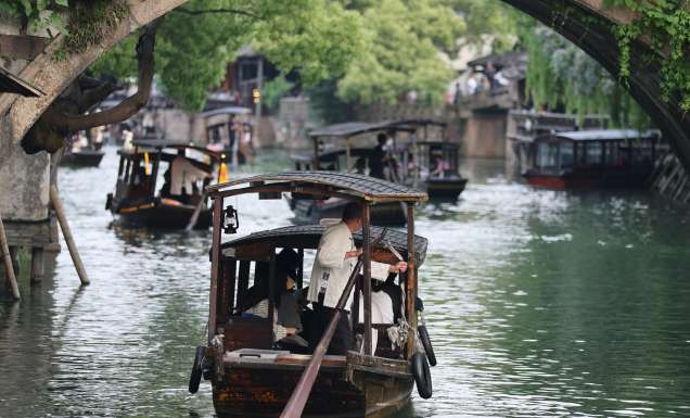 boats gliding past ancient canals in Zhujiajiao