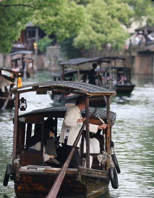 boats gliding past ancient canals in Zhujiajiao