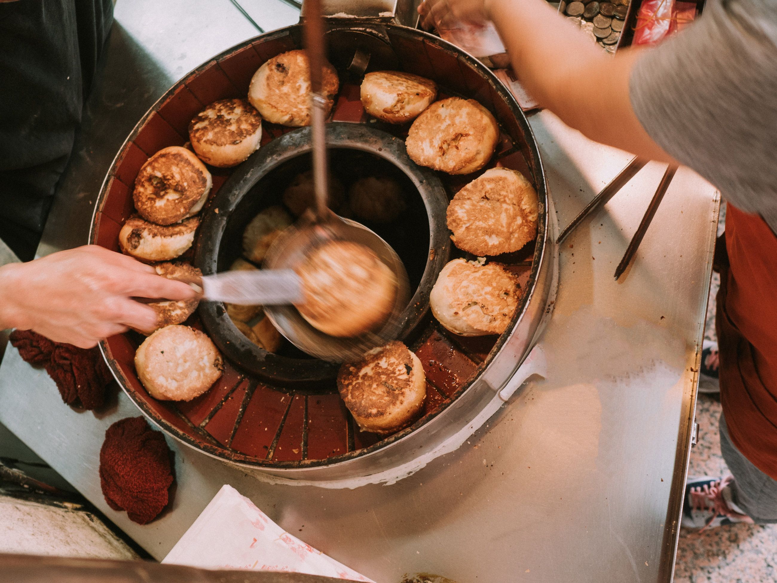 Overhead view of hujiao bing cooking