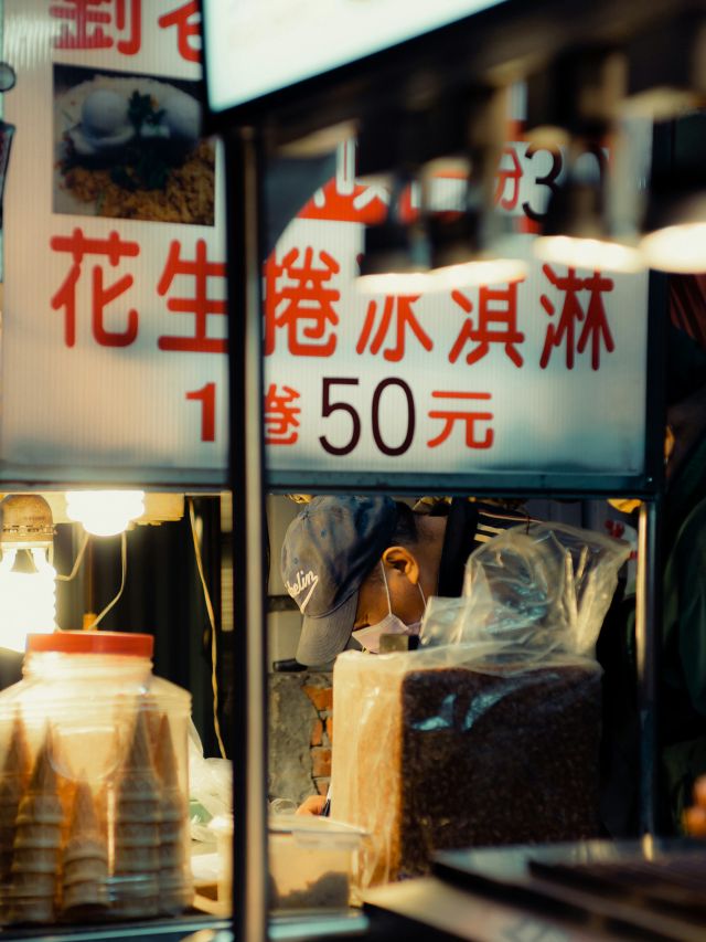 Stall holder at The Shilin Night Markets in Taipei
