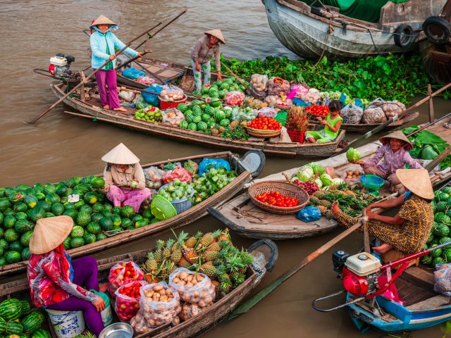 floating market, Mekong River Delta, Vietnam with distant journeys tour