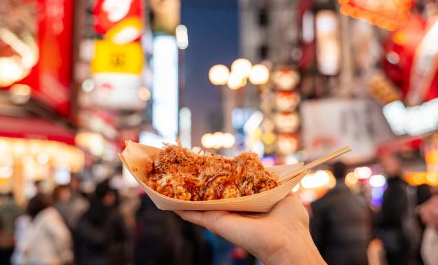 person holding takoyaki in osaka