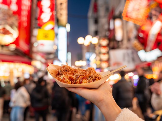 person holding takoyaki in osaka