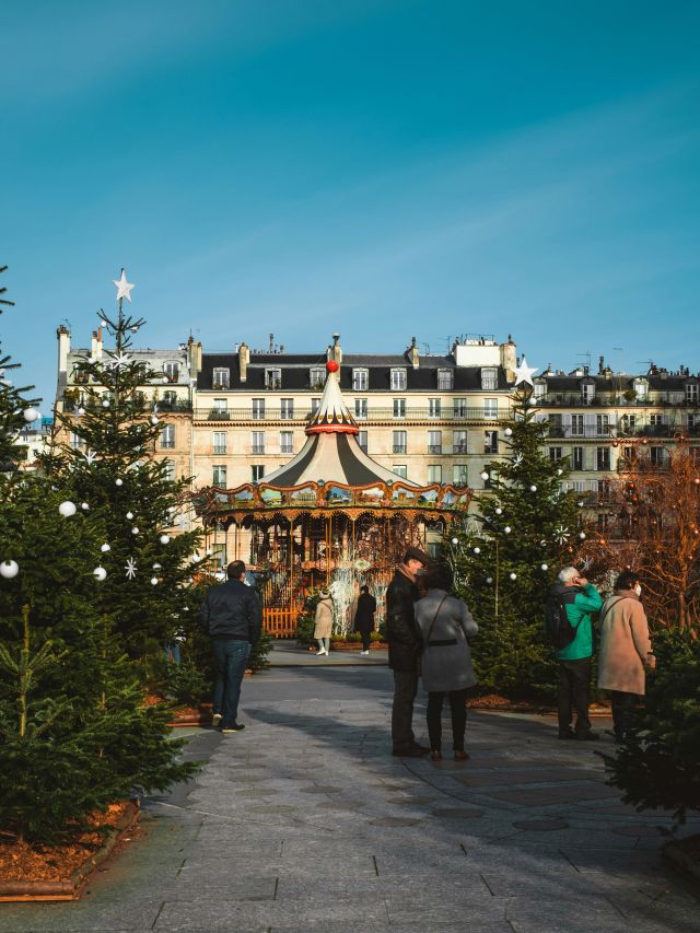 a classic carousel set up during the holiday season in Paris