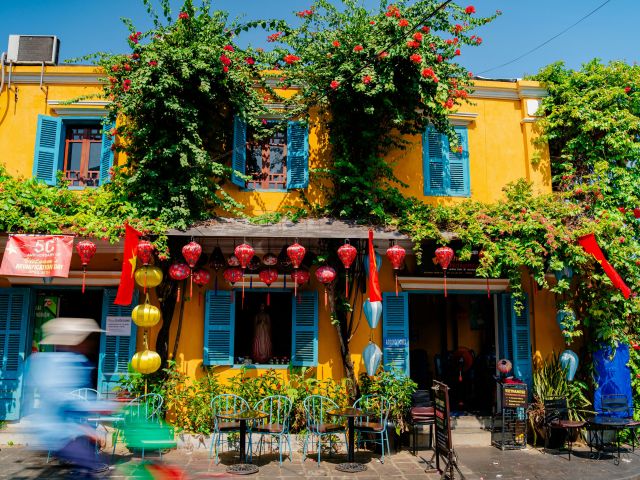 a colourful building with lanterns in Hoi An