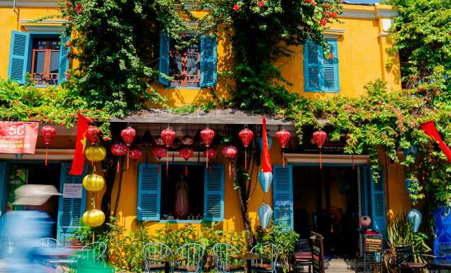 a colourful building with lanterns in Hoi An